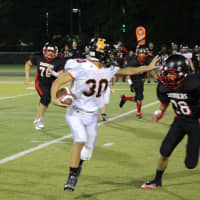 <p>Senior Aviator running back Rocco Minichiello looks to avoid an Elmwood Park player late in the first half.</p>