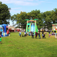 <p>Children could burn off the pizza at one of several bounce houses and interactive inflatables.</p>