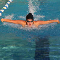 <p>A Hasbrouck Heights swimmer heads into the turn in the 50 meter Butterfly.</p>