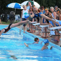 <p>Young swimmers start the race in the 15-yard freestyle.</p>