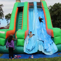 <p>Kids enjoyed racing down the inflatable slides.</p>