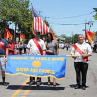 <p>Saddle Brook is celebrating its tricentennial. Council President Joe Camilleri, Councilman Andrew Cimiluca and Mayor Robert White helped Elmwood Park celebrate 100 years</p>