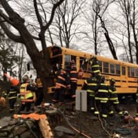 <p>A school bus driver was trapped and students slightly injured following a crash.</p>
