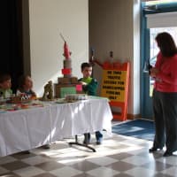 <p>Alexander Gray presents his sculpture, &quot;Saturn V,&quot; at the annual Holmes School Garbage Art Show in the school&#x27;s common room. Pictured from left, Zach Bittker, Tommy Galligan, Hannah Bang, Alexander Gray and Holmes School Principal Paula Bleakley.</p>