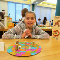 <p>Miranda Schloat, a sixth-grader at John Jay Middle School, shows her Egyptian history project.</p>
