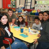 <p>Students from Elmsford&#x27;s Alexander Hamilton Junior/Senior High School mentor younger children at the Dixson Primary School during the school district&#x27;s recent &quot;Day of Service&quot; program.</p>