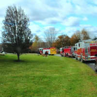 <p>Mahopac Falls fire trucks line Emily Lane during a house fire Sunday.</p>