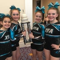 <p>Members of Explosion, a cheerleading team from Extreme Force Allstar Cheer, a Mahopac cheerleading/tumbling program and gym, show off the team&#x27;s trophy in Washington, D.C.</p>