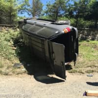 <p>Members of the Bedford Hills Fire Department and Police Department helped a driver who was pinned by their SUV after a rollover.</p>