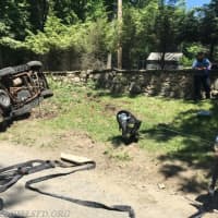 <p>Members of the Bedford Hills Fire Department and Police Department helped a driver who was pinned by their SUV after a rollover.</p>