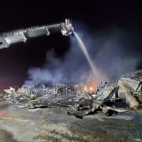 <p>The smoldering rubble of the barn fire  in East Donegal Township.</p>