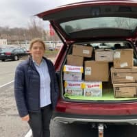 <p>“My SUV fits a lot of stuff. Often I can’t see my child behind the boxes,” said Ulyana Bolgachenko, pictured here. “But she’s used to it now.”</p>