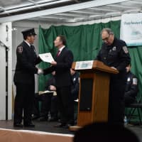 <p>Westchester County Executive Rob Astorino congratulates one of the recent graduates at the fire academy in  Valhalla.</p>