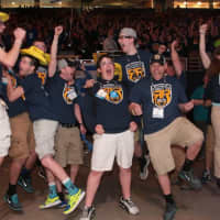 <p>A team celebrates a win at a prior robotics competition sponsored by FIRST®,  an international youth organization that promotes science, technology and engineering.</p>