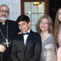 <p>The Very Rev. Fr. Joseph J. Allen with his grandchildren.</p>