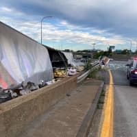 <p>The tractor trailer spilt cans and bottles all across the Mass Pike</p>