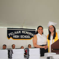 <p>Candice Ripoll, president of the Council of the PTAs, presents Alice Xue with the second place Fairclough Award at Pelham Memorial High School&#x27;s 2016 Commencement.</p>