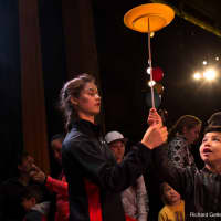 <p>A boy learns the art of plate-spinning at Tarrytown Music Hall&#x27;s Family Fun Day.</p>