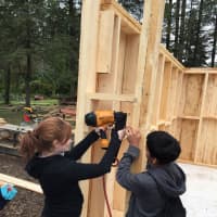 <p>Wooster School students built a shed for a solar water heater during a recent trip to The Farm at Holmes.</p>