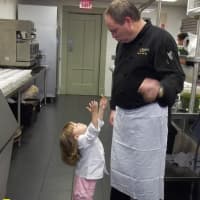 <p>Charles Fells, who with his wife, Megan, owns and operates four, count &#x27;em, four eateries in Poughkeepsie, always makes time on Sunday for dinner with family, friends and adorable 6-year-old daughter, shown here in the kitchen with dad.</p>