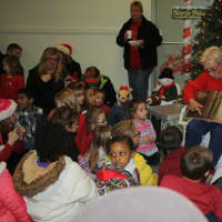 <p>Former Supervisor Penny Hickman read the &quot;The Night Before Christmas&quot; to children attending the event.</p>