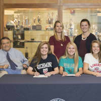 <p>Girls’ Varsity Lacrosse players Maddie Finnen, Hannah Krin and Jenna Joyal with coaches Frank Bice, Lindsay Mulhern and Maeve Carroll.</p>