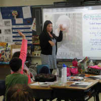 <p>Fifth-grade teacher Lisa Coen discusses float design and advertising in her class at Austin Road Elementary School.</p>