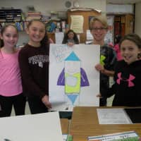 <p>A group of fifth-graders from Austin Road Elementary School show off their design idea for a balloon float for the upcoming Macy&#x27;s Thanksgiving Day Parade.</p>