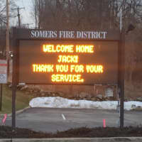 <p>Somers firefighters welcomed Jack Foley home with a sign and a convoy of firetrucks.</p>