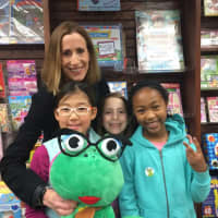 <p>Children posed with Freeda the Frog for a $1 donation. The money went to the Max Cure Foundation.</p>
