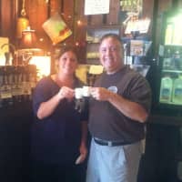 <p>Donna Massaro, owner/chef at The Freight House Café, shares a brew or two with Jonathan Baratz of Bear Mountain Coffee Roasters.</p>