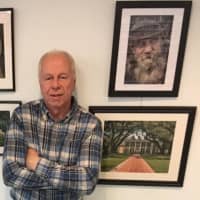<p>Wayne Ross with a selection of his pictures on display at the River Edge Public Library.</p>