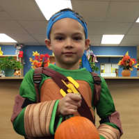 <p>Peter Iodaci, 5, finds a hidden pumpkin. </p>