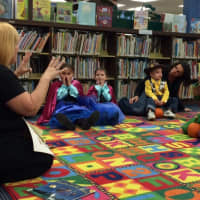 <p>Denise Carrozza, children&#x27;s librarian, leads story time at the Wanaque Public Library&#x27;s Halloween party Saturday morning, Oct. 31. </p>