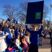 <p>A Hawthorne fan roots on the Bears football team with a sign referencing a &quot;Spongebob Squarepants&quot; episode at the state playoff game against Glen Rock Saturday, Nov. 21. </p>