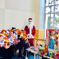 <p>Heavenly Productions Foundation recently held a holiday event at Maria Fareri Children&#x27;s Hospital. Pictured is Santa Claus with gifts.</p>