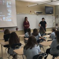 <p>Students at Eisenhower Middle School in Wyckoff listen to Jacy Good.</p>