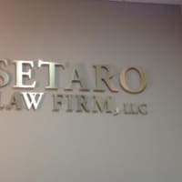 <p>The logo and name of Chris Setaro&#x27;s new firm is proudly displayed on a wall in the lobby of the new offices in Danbury.</p>