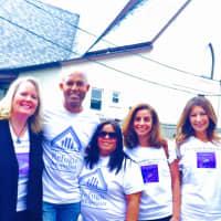<p>Mariano Rivera and his wife, Pastor Clara Rivera, third and fourth from left, helped distribute backpacks with school supplies to children in need at Refuge of Hope Church in New Rochelle.</p>