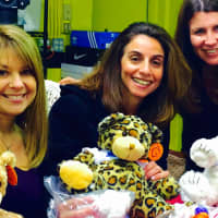 <p>Members of the Heavenly Productions Foundations hope to bring a smile to the face of sick children with these Teddy Bears they made.</p>