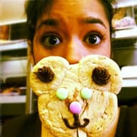 <p>A Butterflake Bakery customer takes a selfie before devouring a treat.</p>