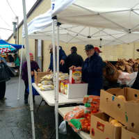 <p>Volunteers from the Black Rock Food Pantry braved chill rain to provide Thanksgiving turkeys and trimmings to 325 families the day before the holiday.</p>