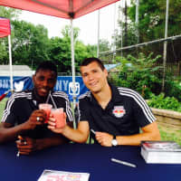 <p>Anatole Abang, #9 (left) and Karl Ouimette, #22 both enjoying Sips &amp; Kick&#x27;s &quot;Red Bull&quot; smoothies.</p>
