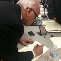<p>Lyndhurst Mayor Robert Giangeruso signs a shared service agreement that will allow a new junior high school to be built.</p>
