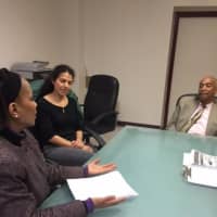 <p>Mother Knoshhali, left, and Reyna Gonzalez, both Mount Vernon residents, present a petition supporting the labeling of GMO foods to state Assemblyman J. Gary Pretlow in Albany.</p>
