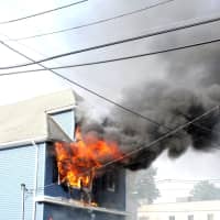 <p>Flames roared from the upper-floor windows.</p>