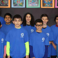 <p>Adam Brown, interim principal at Pocantico Hills School, with competitors from this year&#x27;s Geography Bee.</p>