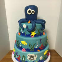 <p>A baby shower cake created by Gina Gray is topped by an octopus and decorated with other denizens of the deep.</p>