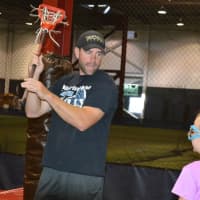 <p>Mahwah Varsity Lacrosse Coach Brian Girardi demonstrates a throw during X-Treme Lax Factory Club Team&#x27;s tryouts on Sept. 20.</p>