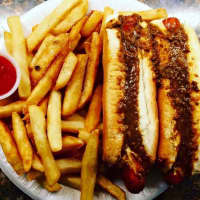 <p>Two Texas weiners &quot;all the way&quot; with a side of fries at The Goffle Grill in Hawthorne.</p>